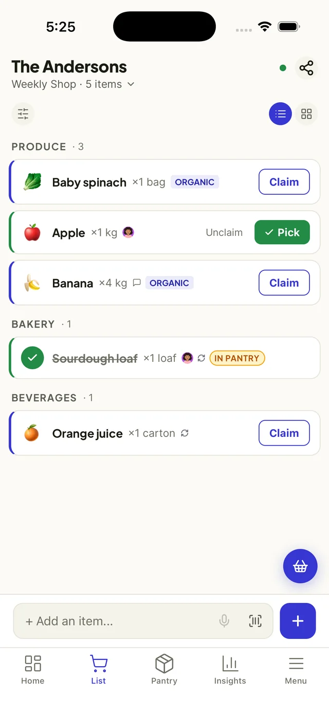 FamBasket shared grocery list on iPhone with items claimed by family members